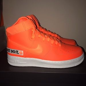 Neon orange Nike tennis shoes